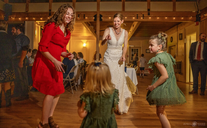 Bride Dancing at her Wedding Reception at Beaver Ranch Event Center in Colorado
