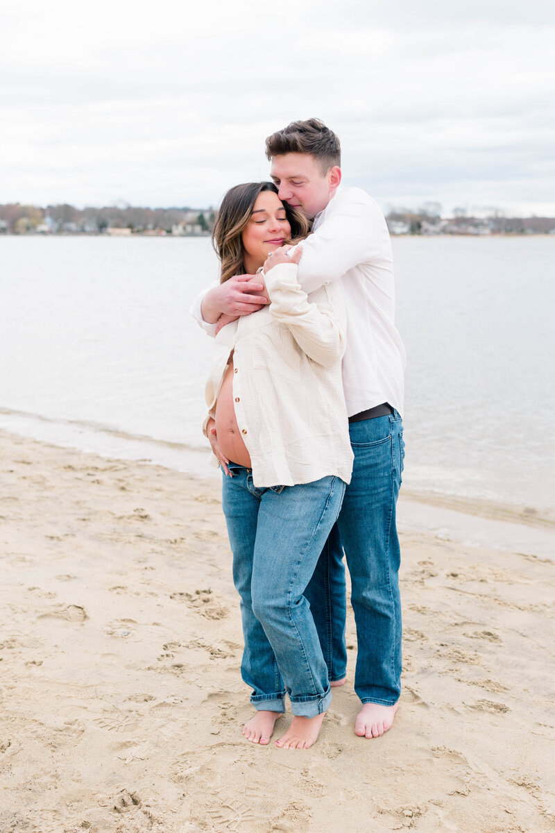 Wedding Photographer Newport RI | Rhode Island Caprio Captured Photography | Maternity Session With A Couple Embracing At The Beach