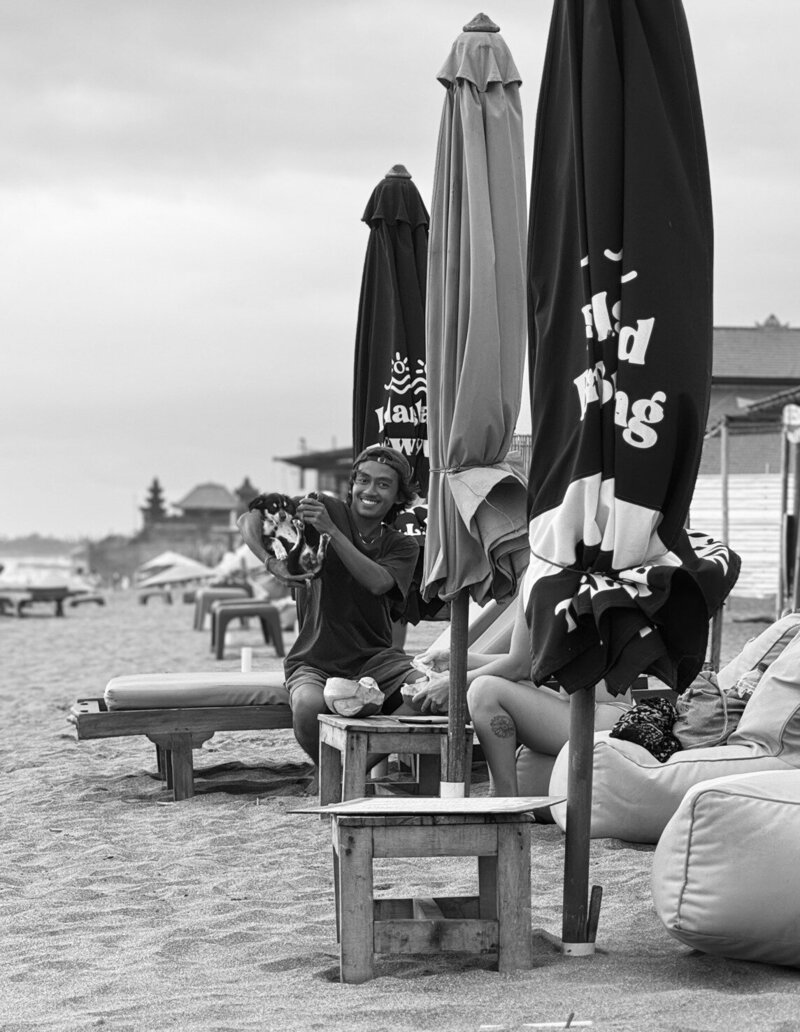 A group of satisfied students celebrating their first successful surf session in Canggu.