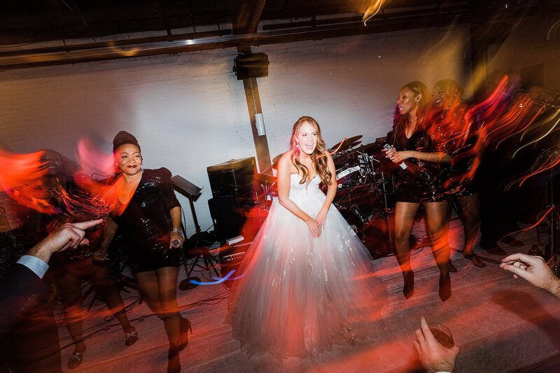 bride dancing with wedding band