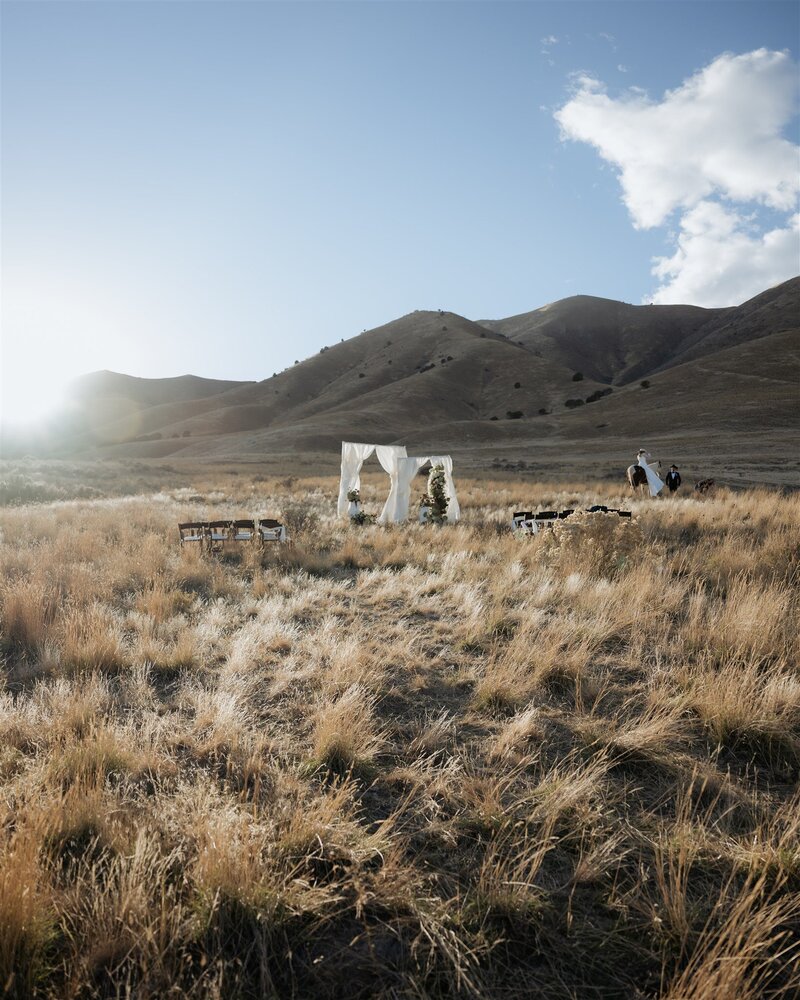 Ceremony location with an A frame style arch with minimalist styling.