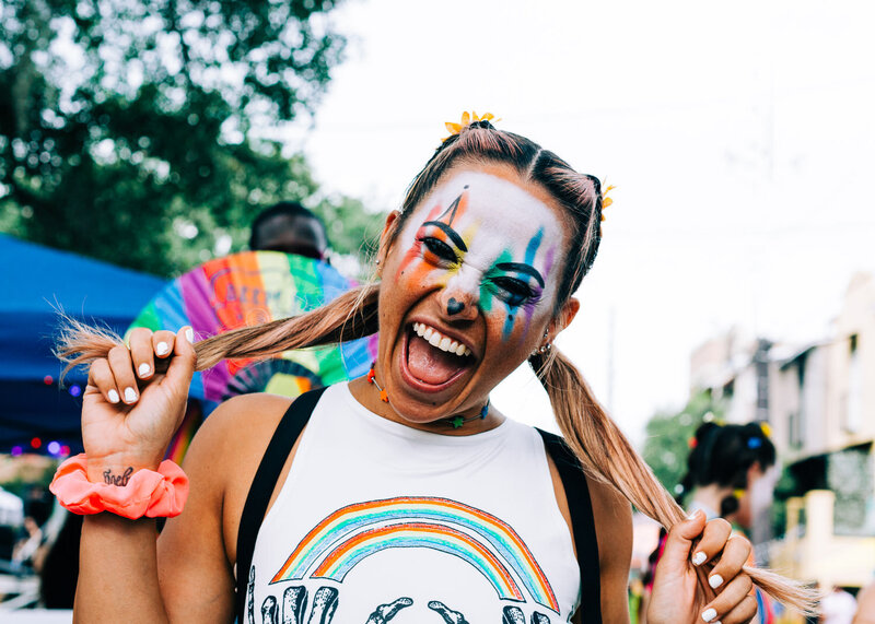 Pride LGBTQ+ event with dancer with clown rainbow make up