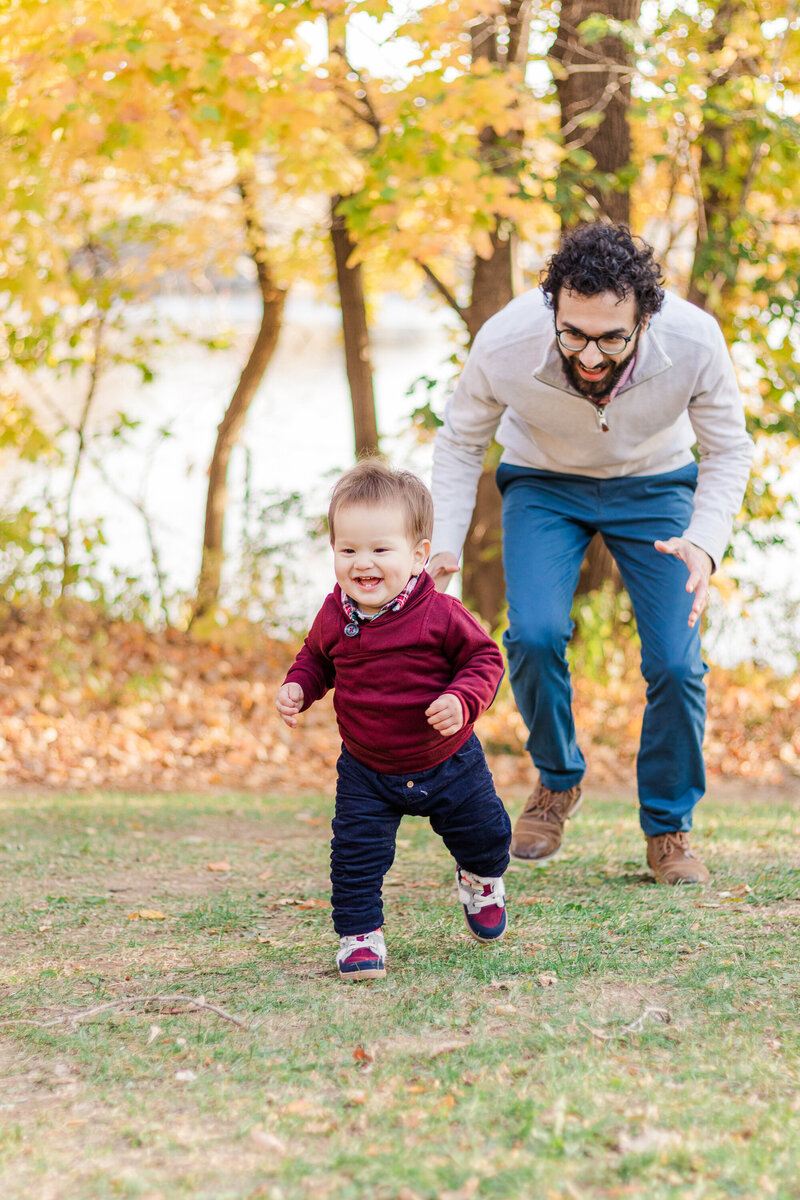toddler playing with his dad