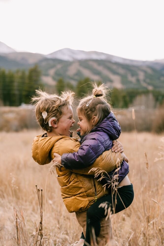 photo of kids smiling at each other