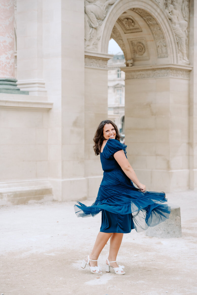 wedding photographer in blue dress spinning. 