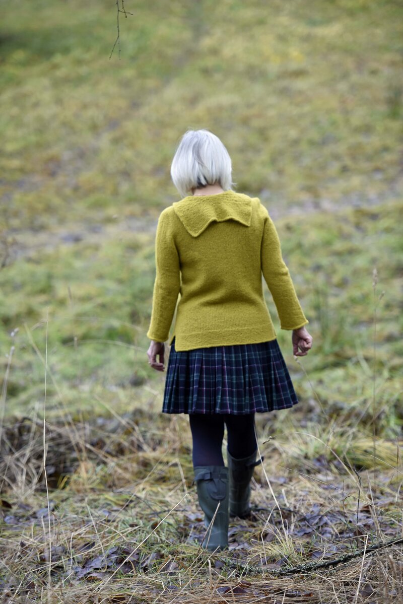 women in the grass walking