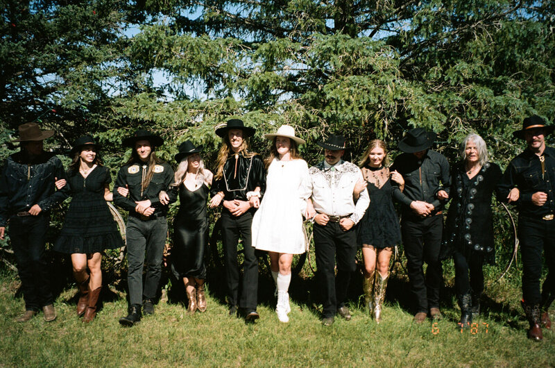western wedding party linked arms