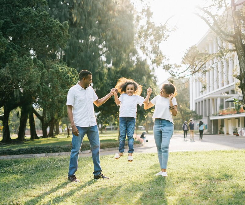 parents walking with daughter