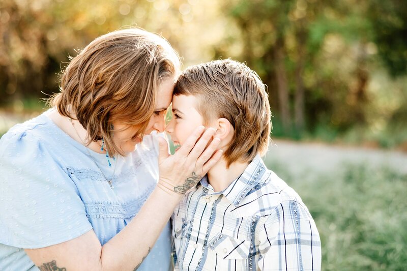 Mom and son share eskimo kisses during family photo session