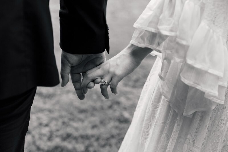 Editorial wedding holding hands