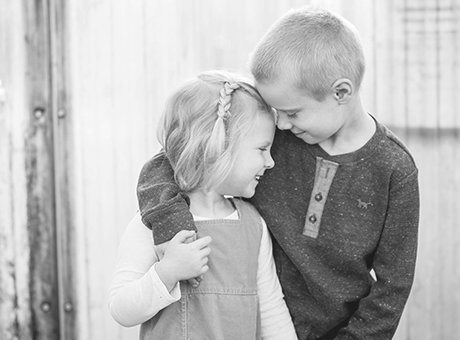 Brother and Sister hugging -  black and white children's photography