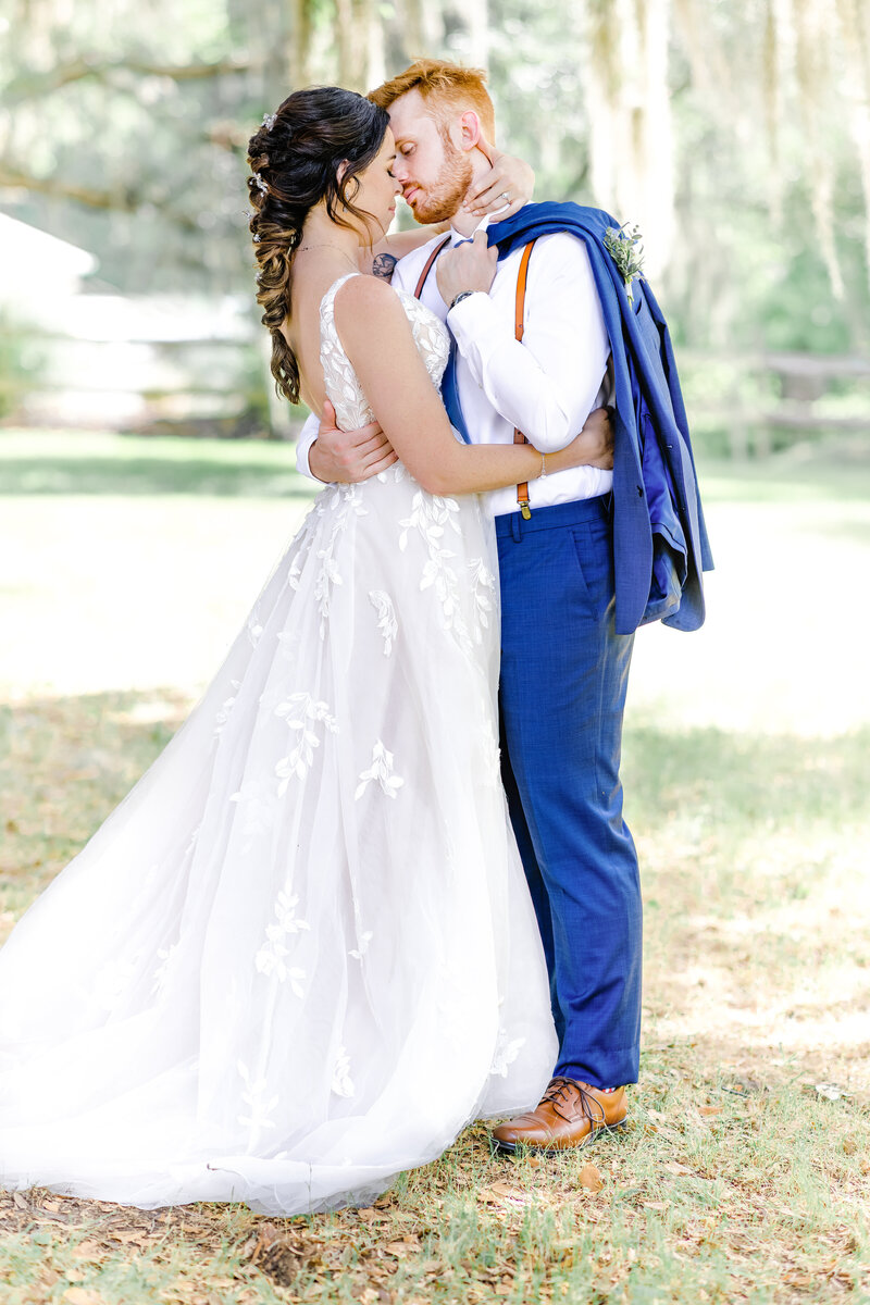 Bride and groom lost in each other's eyes, sharing a quiet, romantic moment filled with deep connection and warmth