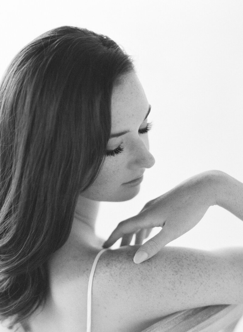 A bride poses for Denver bridal boudoir photos.