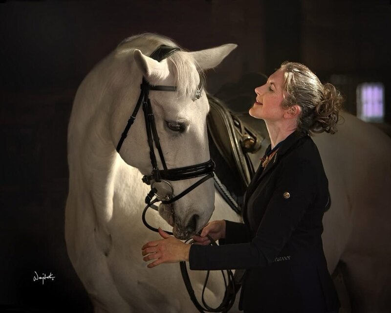 Woman and horse connecting deeply after an Animal Communication Mentorship Session. 