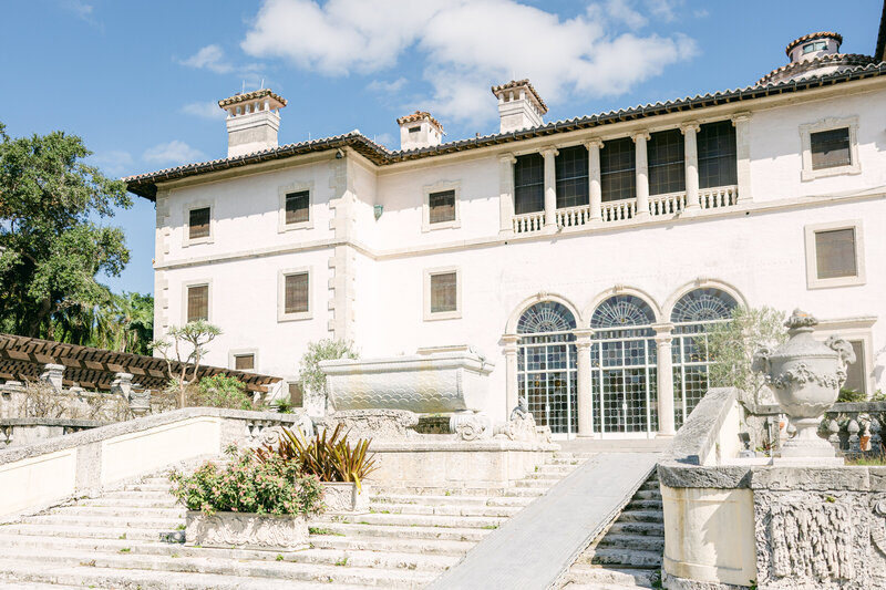 A stunning view of Vizcaya Museum & Gardens, a luxurious and historic wedding venue in Miami, Florida. Captured in elegant natural light, this breathtaking location offers a timeless setting for a romantic wedding celebration. Amia Marcell editorial photographer, destination wedding photographer.