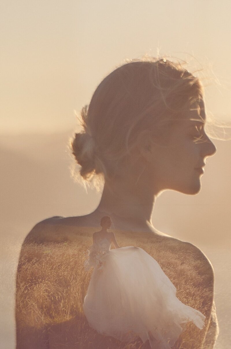 A golden light outdoor photoshoot of a woman wearing a couture dress.