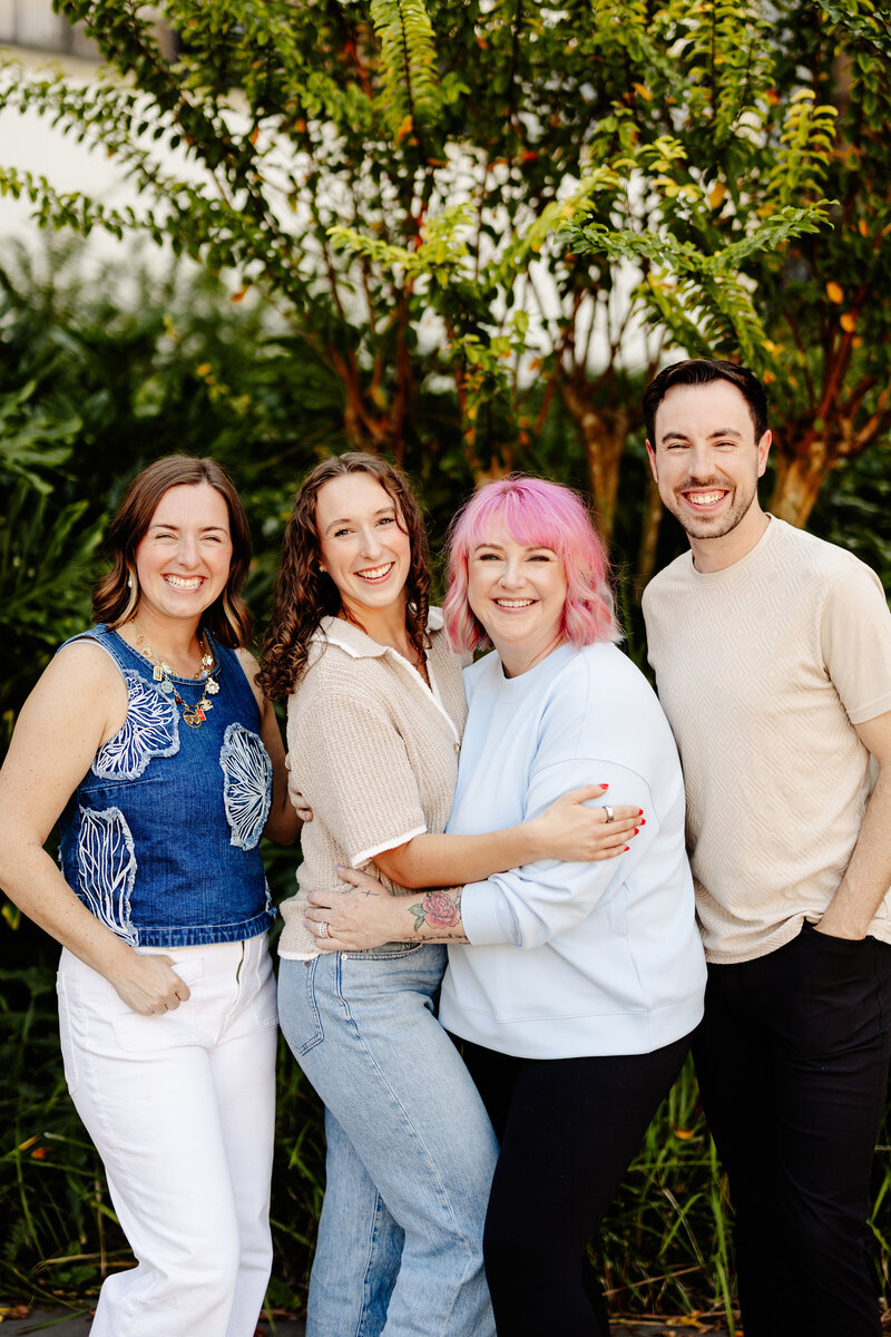 Grow your wedding business, florist student posing with florals