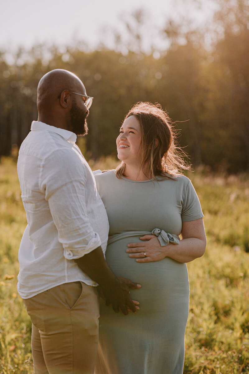 golden hour fall maternity session with couple at Assiniboine Forest