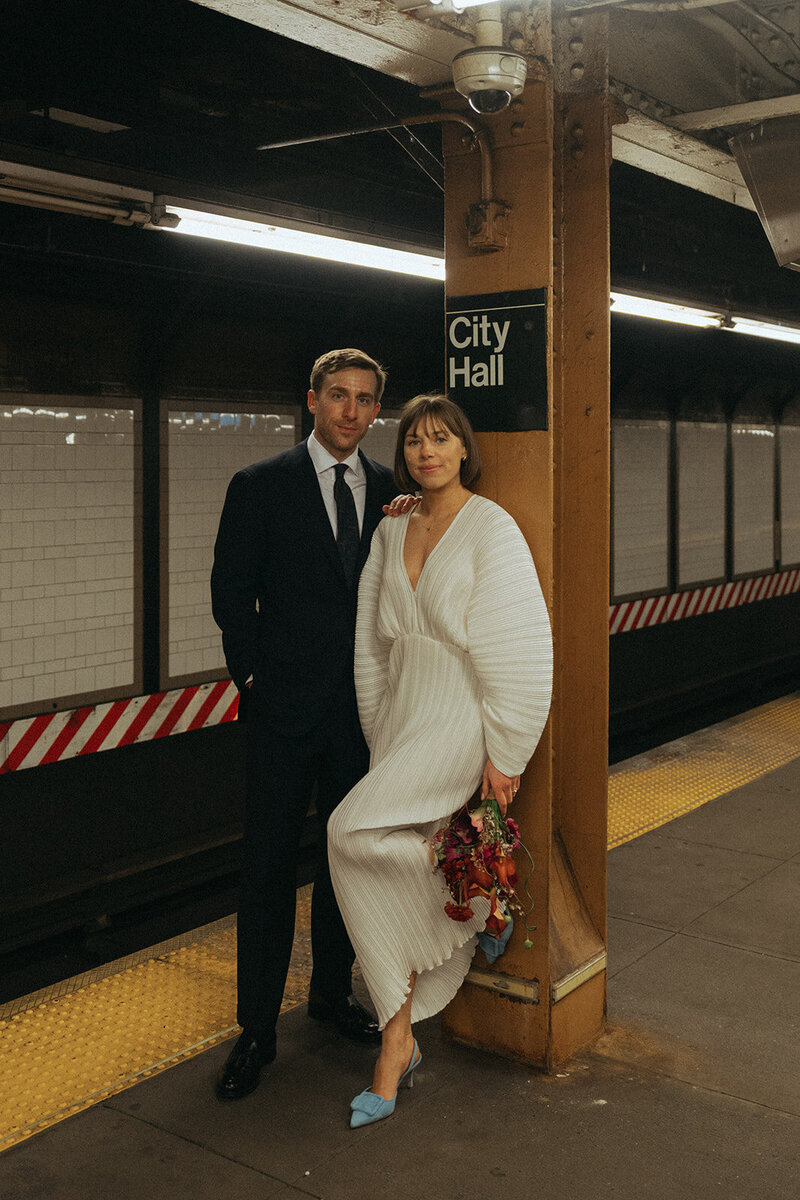 bride and groom at the city hall subway stop shot by Elsie Goodman Photography | NYC Elopement Packages