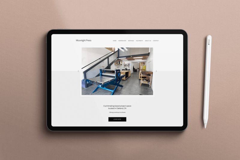 Tablet mockup of the Moonlight Press website showing a modern e-commerce layout with printmaking studio photo and workshop details.