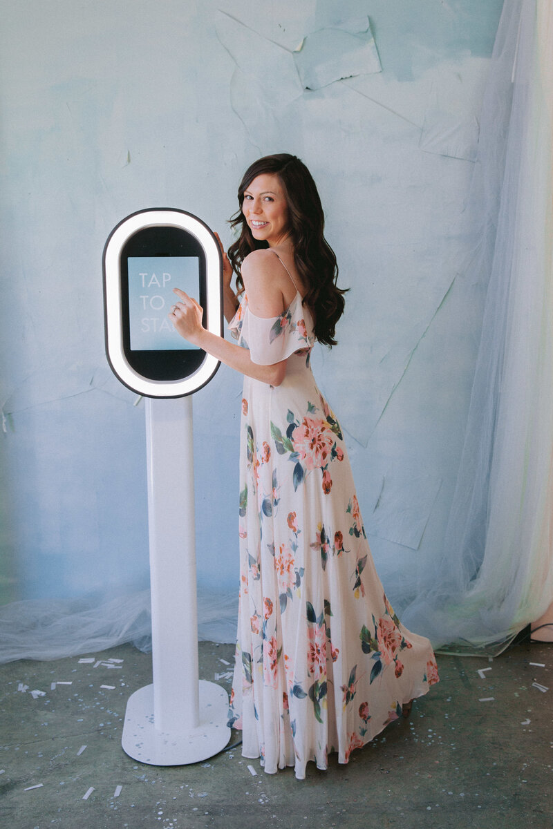 Guests enjoying a fun selfie booth experience at a wedding in Los Angeles
