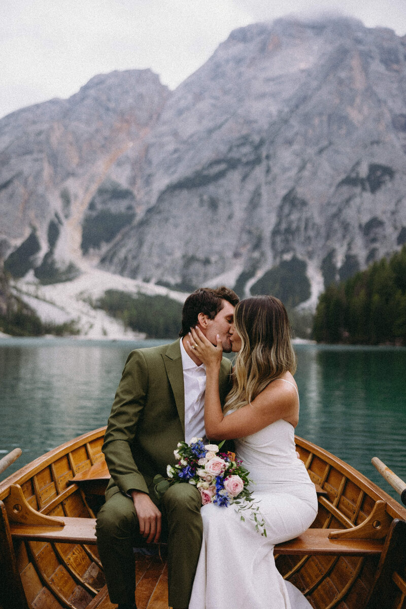 Couple in love on their wedding day in Italy, with the timeless beauty of the Dolomites as a backdrop.