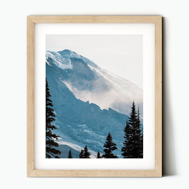 Framed image of a cloud settling in between the ridges of Mt Rainier