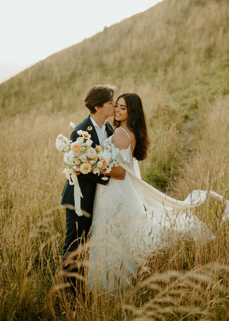 Kourtney and Sage dancing in forest on their elopement day