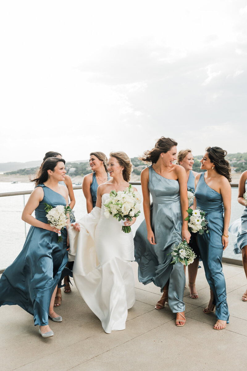 bride with bridesmaids in blue dresses