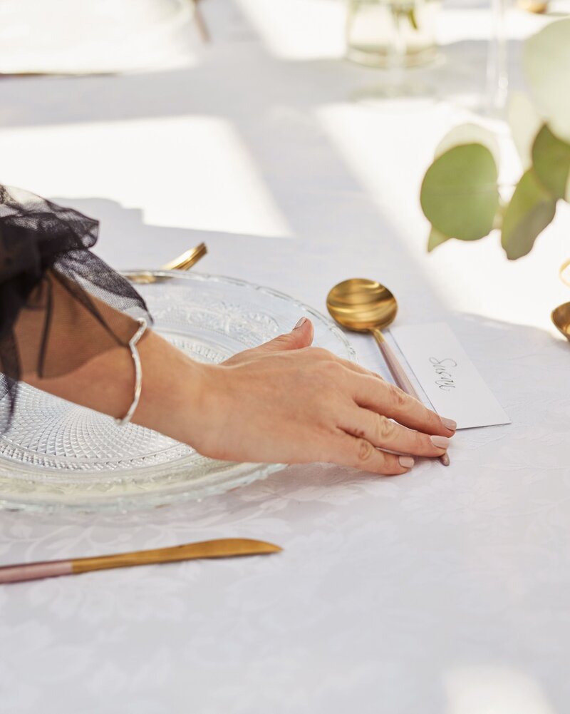 Woman hand setting a table