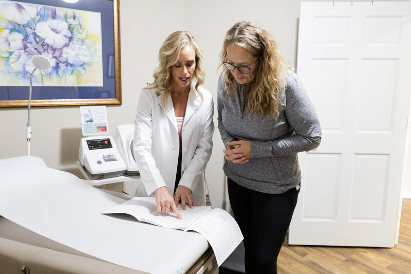 Jamie with a patient in the office