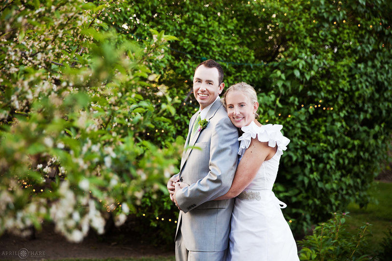 Fort Collins Wedding Venue portrait of couple in the greenery at Tapestry House