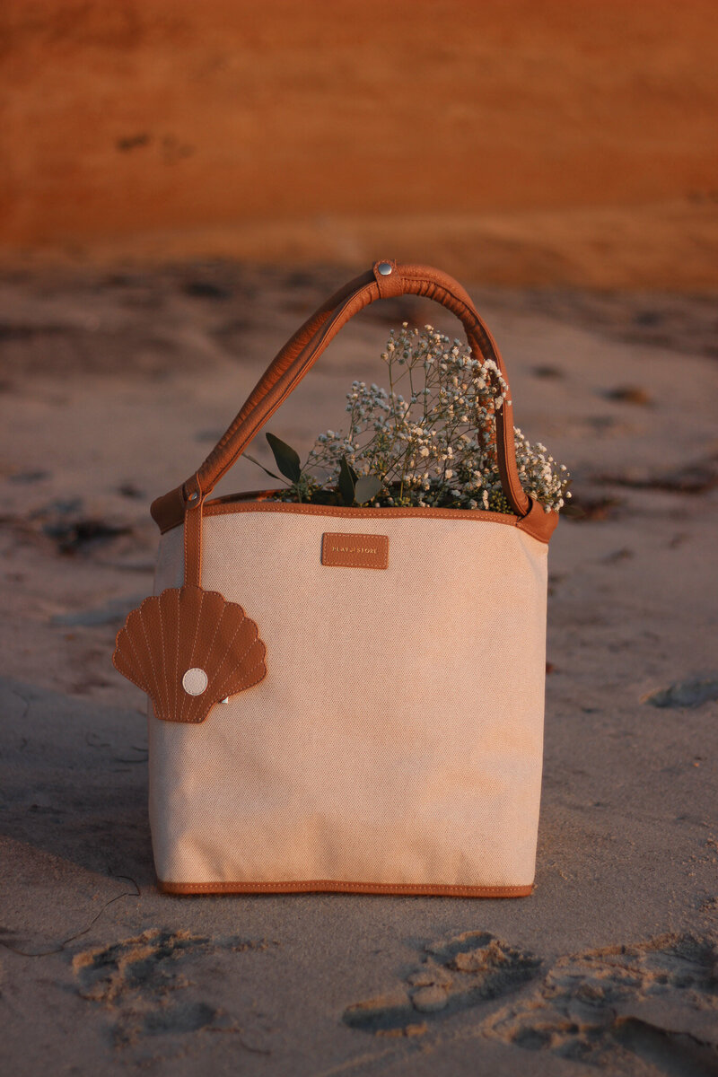 Warm toned beach bag brand product photography