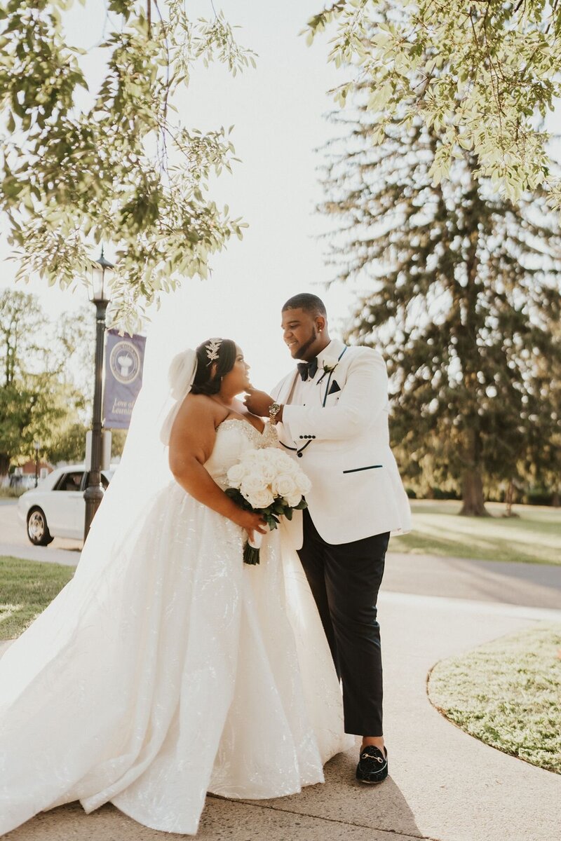 Plus size couple embraces at their Raleigh NC wedding