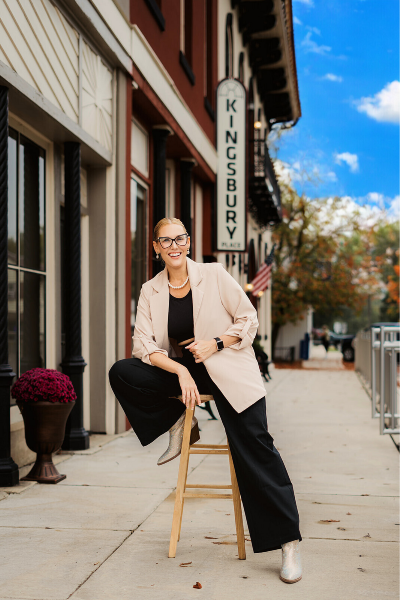 Owner of Indianapolis wedding hair and makeup company smiling while working