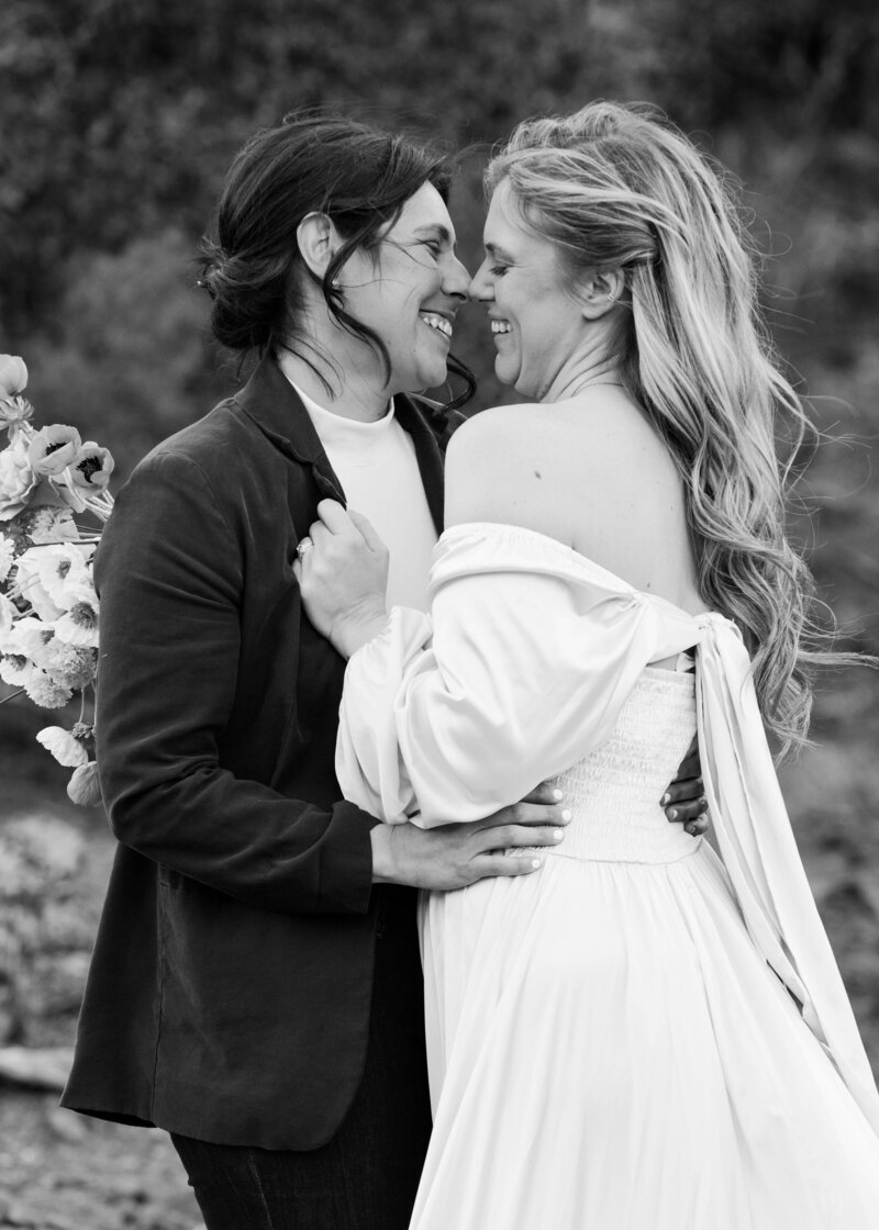 Lesbian couple embracing during their wedding