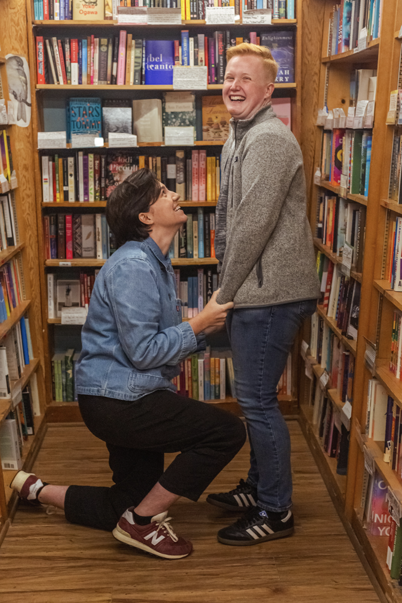queer couple (t4t) surprise proposal at a san francisco bookstore