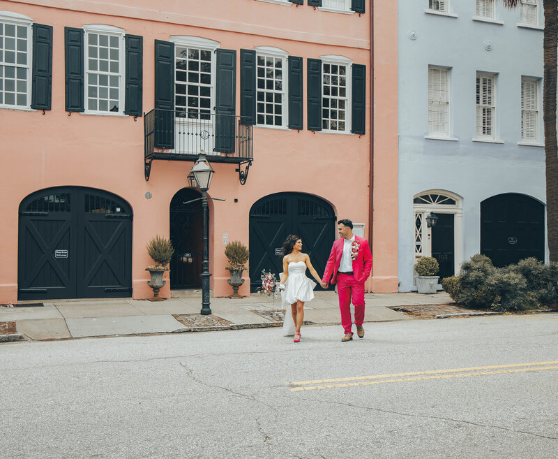 couple kissing on rainbow row