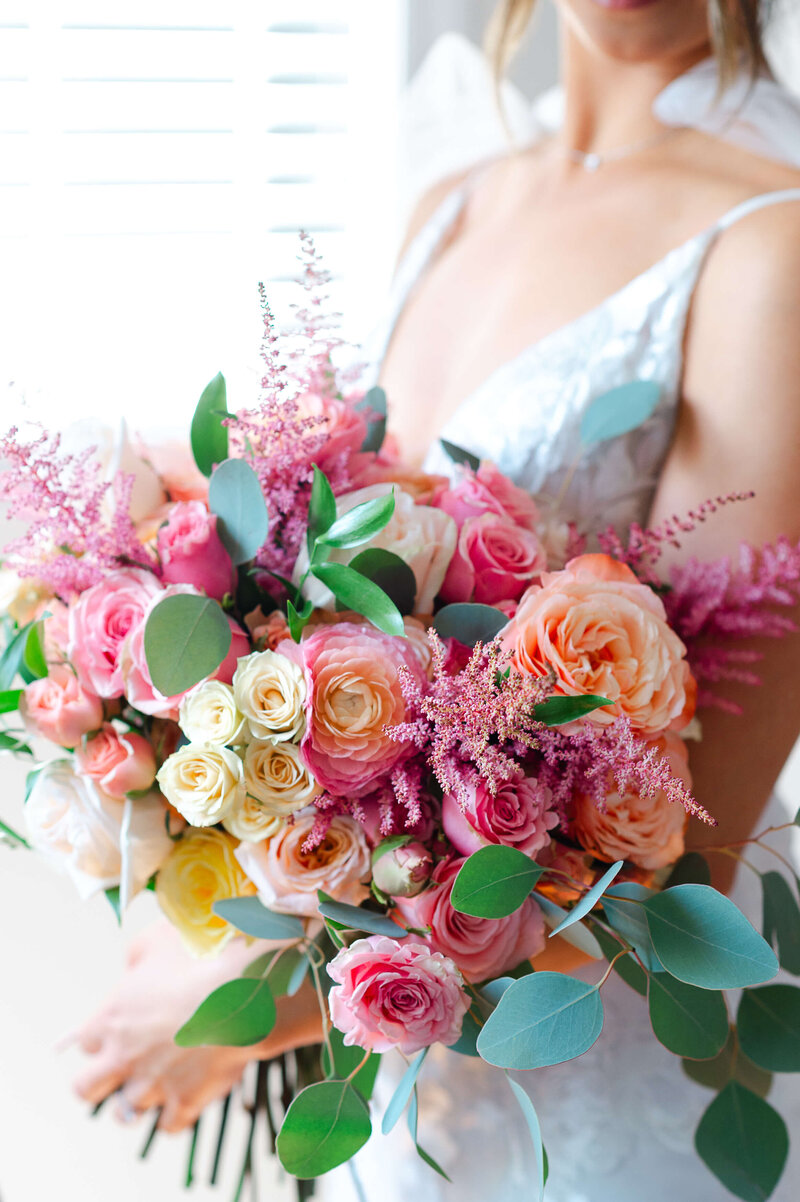 a closeup photo of a pink bouquet held by a bride.  Captured by Ottawa wedding photographer JEMMAN Photography