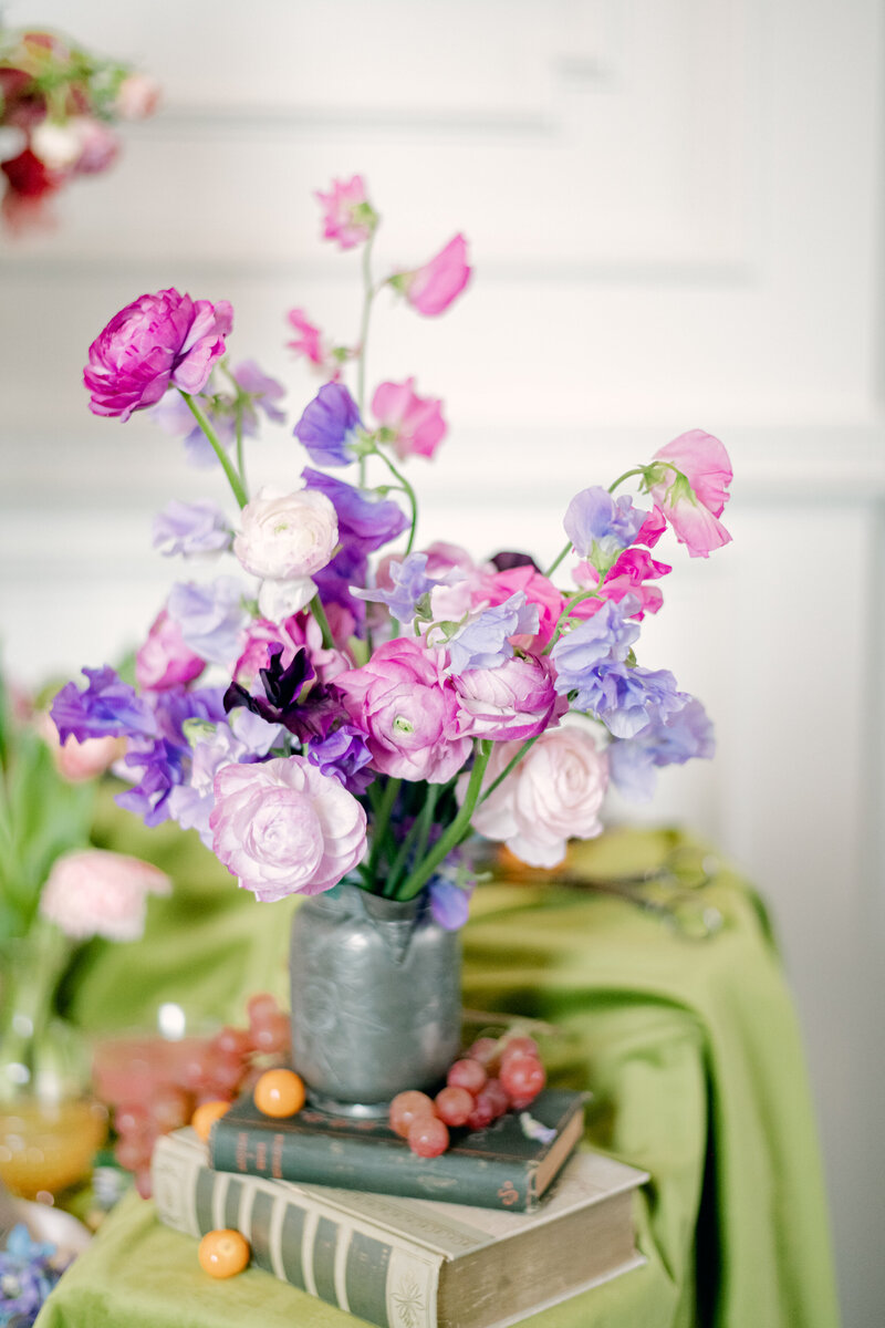 Pink and purple florals in a rustic metal gray vase