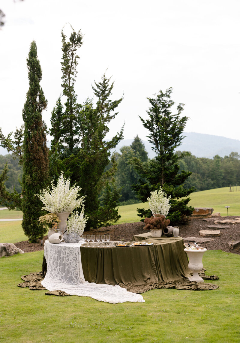  Elegant table settings with candles and florals at Hotel Domestique’s reception area.