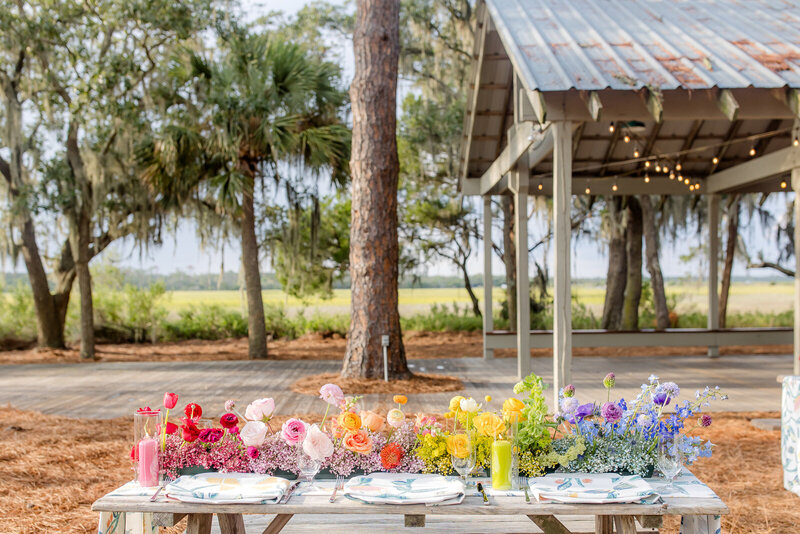 Outdoor venue with a green lawn and luxurious beach house