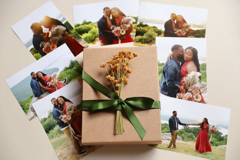 Printed photos displayed with a decorative gift box