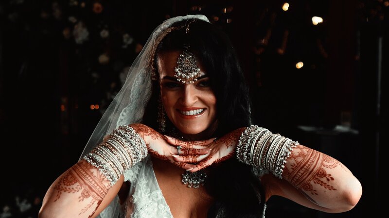An Oxfordshire Bride on her wedding day captured by wedding videographer Scott from HC Visuals. The bride is cool with a unique look, making her oxfordshire wedding special to the couple.