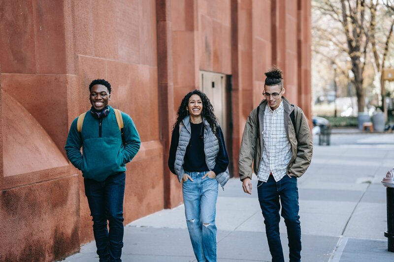 A picture of a group of teens walking outside together