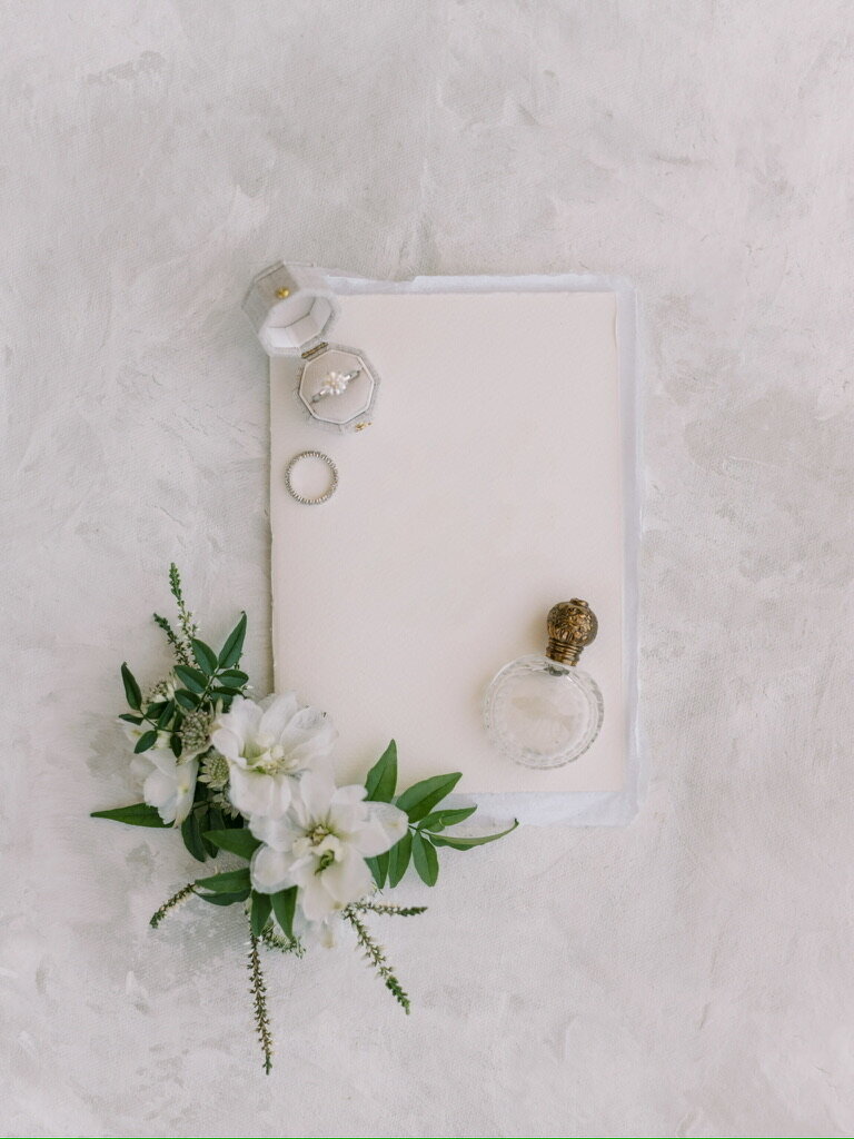 Wedding paper and rings.