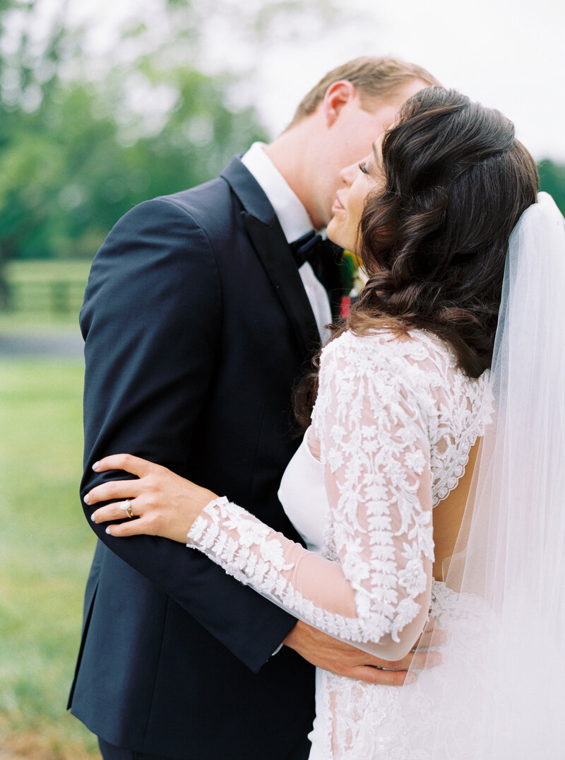 Bride and Groom embracing under wedding veil at Asbury Estes Chapel, Lexington Kentucky Wedding Photographer, Katelyn V. Photography
