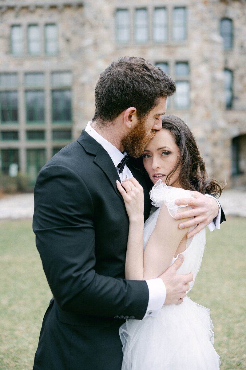 bride and groom embracing