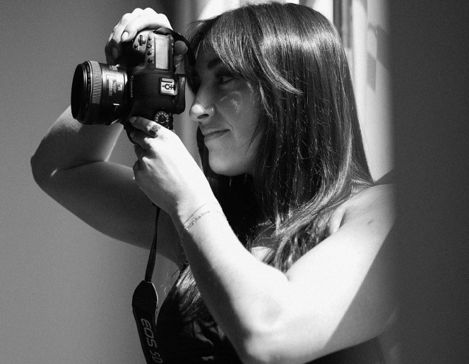 Dani Antony taking a picture with her DSLR camera