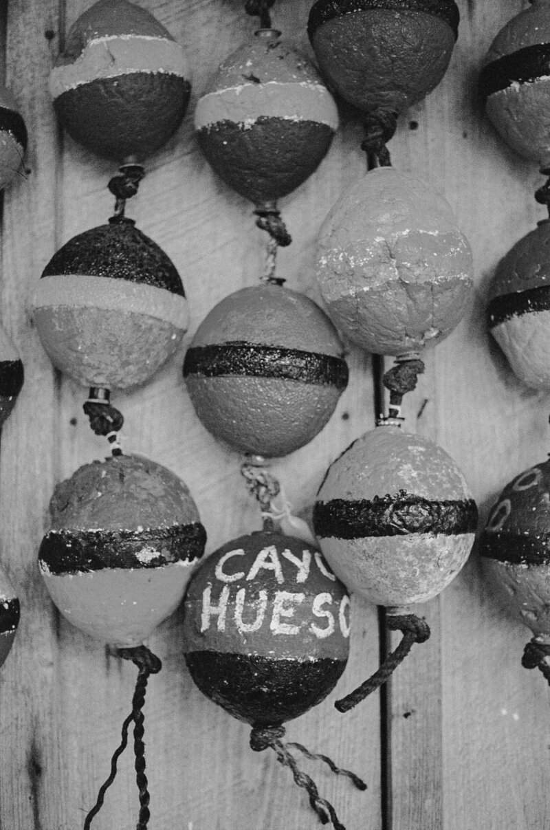 small buoys hanging on a wall